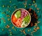 Overhead shot of a salad bowl with raw meat surrounded by beans grated carrots and