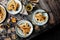 Overhead shot of thin yummy crepes with honey, blueberries on three vintage plates