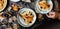 Overhead shot of thin yummy crepes with honey, blueberries on three vintage plates