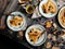 Overhead shot of thin yummy crepes with honey, blueberries on three vintage plates