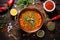 overhead shot of traditional lentil soup with spices scattered around