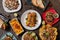 Overhead shot of traditional Mexican dishes like tacos and enchiladas on a table at a restaurant