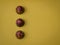 Overhead shot of unusual-looking chocolate candies on a yellow surface