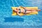 Overhead Shot Of Woman In Bikini Floating On Air Bed On Summer Vacation In Outdoor Swimming Pool