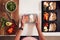 Overhead Shot Of Woman Preparing Batch Of Healthy Meals At Home In Kitchen