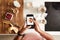 Overhead Shot Of Woman Taking Picture Of Healthy Breakfast On Mobile Phone At Home After Exercise