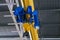 Overhead traveling cathead with steel hooks in industrial engeenering plant shop