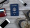 Overhead view of basic travel objects on aged wood