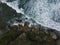 Overhead view of beach wave hit the coral reef and produce white foam