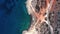 Overhead view of blue sea and a rocky shoreline