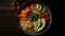 overhead view, Bowl Buddha. Buckwheat, pumpkin, chicken fillet, avocado, carrots. black background