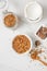 Overhead view of bowl with granola with coconuts and chocolate