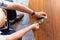 Overhead view of caucasian senior man measuring his blood sugar using glucometer at home