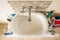 Overhead View Classical Acrylic Top Sink along with a full bathtub and faucets