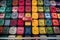 overhead view of colorful luggage on conveyor belt