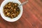 Overhead view of cooked mushrooms in a white bowl