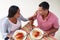 Overhead View Of Couple Eating Meal Together