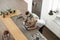 Overhead View Of Couple Looking At Laptop In Modern Kitchen