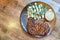 Overhead view of deicious beef steak perfectly grilled over fire with side dishes served