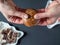 Overhead View Female Hand Break Christmas German Dark Chocolate Lebkuchen Cake Over Dark Background