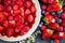 Overhead view on fresh strawberry pie with berries fruit on side