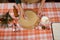 Overhead view hands of chef confectioner sprinkling flour on rolled out dough, making gingerbread cookies for Christmas