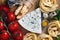 Overhead view of ingredients for an Italian pasta recipe on rust