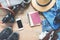 Overhead view of man`s accessories, Traveler items on wooden background.