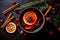 Overhead view of a mug of warm festive mulled wine with spices