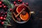 Overhead view of a mug of warm festive mulled wine with spices
