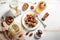 Overhead view on Muslim iftar breaking fast with dried dates, nuts and sweet drinks, with lantern lamp as decoration on