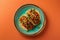 Overhead view of a plate of fresh mexican tacos on a bright color background