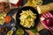 overhead view of plate of macaroni with meat and mix of vegetables