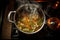overhead view of a pot simmering soup on stove