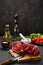 Overhead view of raw lamb rump on cutting board