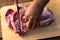 Overhead view of raw piece of pork on wooden background. Piece of fresh boneless pork, neck part or collar. Big piece of red raw m