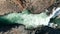 Overhead view rough glacier water flowing in Stuolagil canyon with basalt volcanic rock formations. Top down view