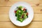 Overhead view of salad with onion, beetroot, tomato, feta