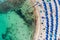 Overhead view of Sandy Bay beach in Cyprus with swimmers and sunbathers