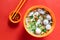 Overhead view of simple Chinese fishball noodle soup served in bowl