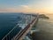 Overhead view of span with light traffic on suspension bridge at sunset