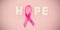 Overhead view of spotted Breast Cancer Awareness ribbon with HOPE text