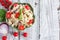 Overhead View of Tomato, Black Olive, and Feta, Pasta Salad with Freshly Chopped Basil