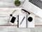 Overhead view of a traditional office desktop on white rustic wooden desktop