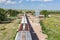 Overhead View of Train Passing Old Grain Elevator