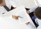 Overhead View Of Two Businessmen Working At Desk Together