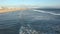 Overhead view of waves crashing to shore in the Pacific Ocean