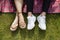 Overhead view of young couple lying on picnic blanket at park, closeup of feet