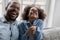 Overjoyed african american family in eyeglasses laughing at funny joke.