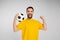 overjoyed bearded man with soccer ball